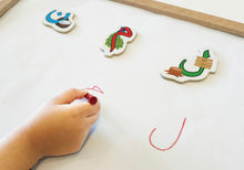 Load image into Gallery viewer, child using urdu letter magnets to learn writing in urdu